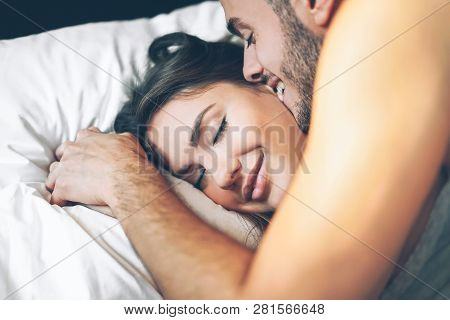 Happy Romantic Couple Having A Tender Moment In The Bed - Young Passionate Lover Waking Up In The Mo