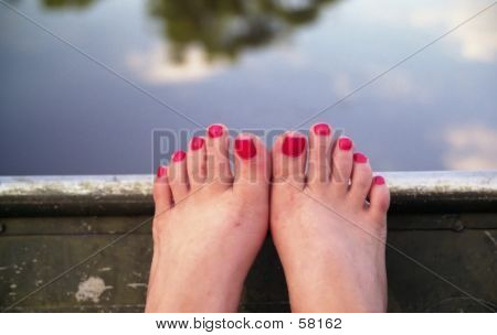 Feet In A Boat