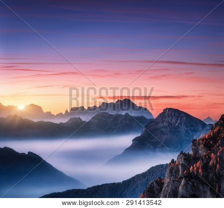 Mountains In Fog At Beautiful Sunset In Autumn In Dolomites, Italy. Landscape With Alpine Mountain V