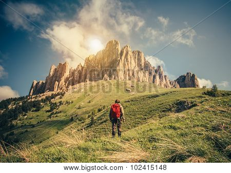 Young Man with backpack relaxing outdoor Travel Lifestyle