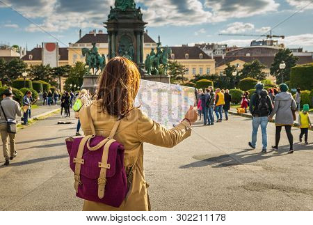 Traveler Girl With Map In Vacation. Young Traveler Girl In Vacation. Girl Traveling Alone With Map I