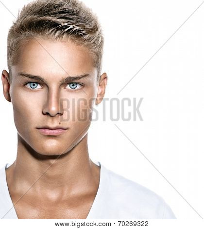 Handsome young man's face. Portrait on cheerful teen guy isolated on a white background