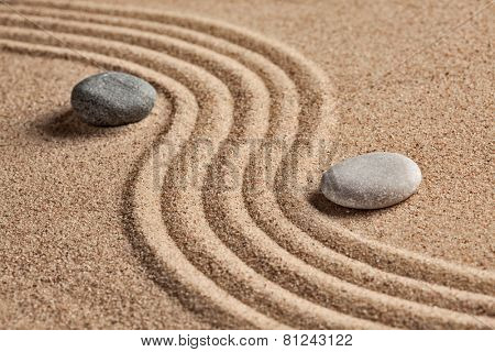 Japanese Zen stone garden - relaxation, meditation, simplicity and balance concept  - pebbles and raked sand tranquil calm scene