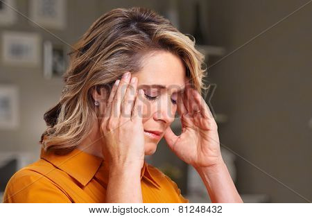 Woman having headache migraine. Stress and depression.