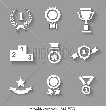 Set of white vector award  success and victory icons with trophies  stars  cups  ribbons  rosettes