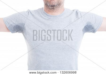 Man With Arms Raised And Sweat Stains