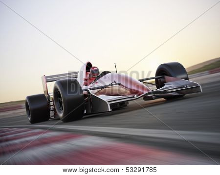 Race car racing on a track with motion blur.