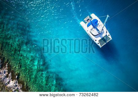 Amazing view to Yacht sailing in open sea at windy day. Drone view - birds eye angle