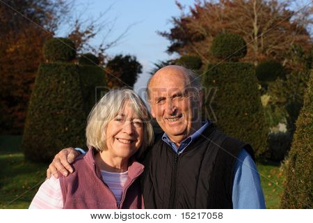 Day out for a senior couple in formal gardens.