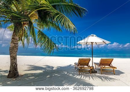 Maldives Beach With Luxurious Water Villas And Loungers Beautiful Tropical Scene. Luxury Summer Trav