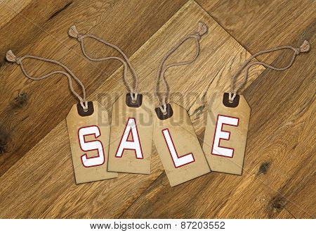 Textured Tag with Sale Tied With Brown String