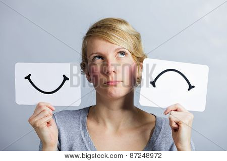 Portrait Of A Person Holding Happy And Unhappy Mood Board