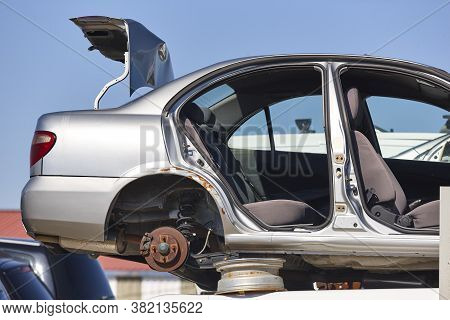 Car Scrapyard. Stacked Damaged Vehicles Ready To Be Recycling. Automotive