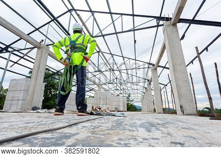 Asian Engineer Technician Watching Construction Control In The Construction Of Roof Structures On Co