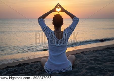 Woman Doing Yoga In Nature. Yoga In Nature. Yoga Lifestyle. Healthy Lifestyle. Woman Doing Yoga On B