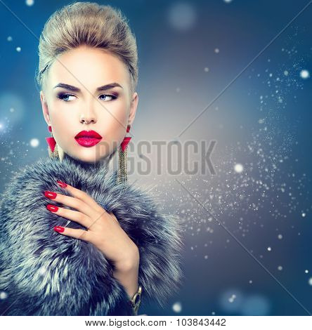 Winter Woman in Luxury Fur Coat. Beauty Fashion Model Girl in Blue Fox Fur Coat. Perfect Makeup and accessories. Beautiful Luxury Winter Lady