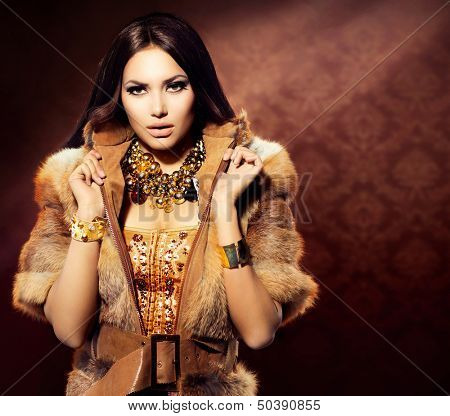 Beauty Fashion Model Girl in Fox Fur Coat. Beautiful Woman in Luxury Red Fur Jacket