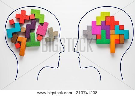 The concept of rational and irrational thinking of two people. Heads of two people with colourful shapes of abstract brain for concept of idea and teamwork. Two people with different thinking.