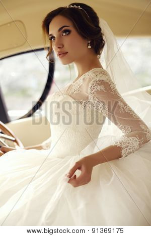 Beautiful Sensual Bride With Dark Hair In Luxurious Lace Wedding Dress