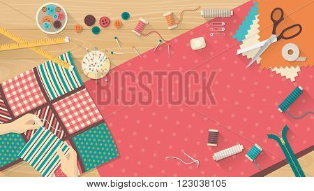 Seamstress working with quilting fabric sewing equipment and fabric on a wooden worktop sewing hobby and creativity concept