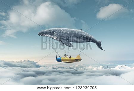 Take me to the dream, travel concept. Whale floats in the air above the clouds carrying children in a yellow airplane.