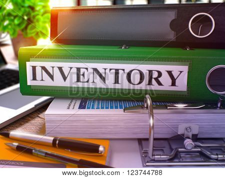 Green Office Folder with Inscription Inventory on Office Desktop with Office Supplies and Modern Laptop. Inventory Business Concept on Blurred Background. Inventory - Toned Image. 3D.