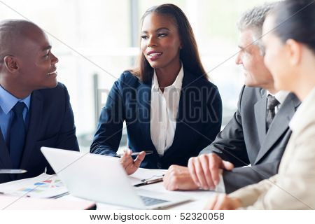 group of businesspeople having a meeting in modern office