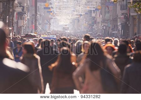 people crowd walking on busy street on daytime