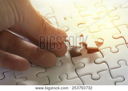 Business Strategy, Finish Or Finalize, Problem Solution Metaphor Concept, Man Holding Last Piece Of 