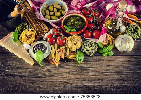 Italian and Mediterranean food ingredients on old wooden background.