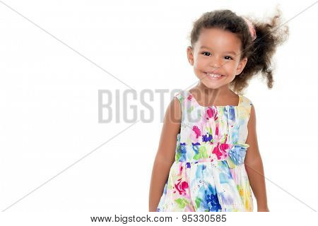 Cute small african-american or hispanic girl wearing a flowers summer dress isolated on white