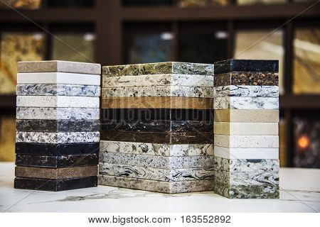 Kitchen counter tops of granite marble and quartz, blurry background of granite kitchen countertops, assortment kitchen counters, countertop samples, granite counter colors, kitchen worktops on marble counter