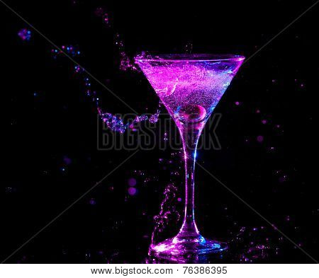 colourful cocktail on the black background. Party club entertainment. Mixed light