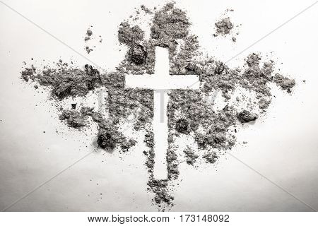 Ash wednesday cross crucifix made of ash dust as christian religion Jesus god faith holy holiday concept background