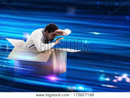 Man in a cardboard box on wires optical fibers with binary codes