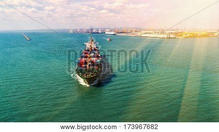 container ship in import export and business logistic.By crane Trade Port Shipping.cargo to harbor.Aerial view.Water transport.International.Shell Marine.Top view.