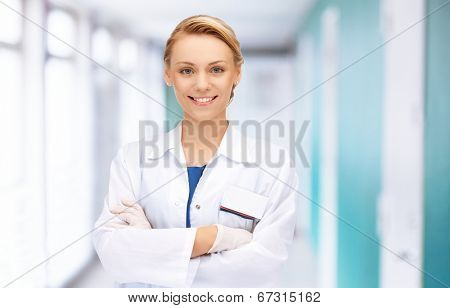 medicine and healthcare concept - attractive female doctor in hospital