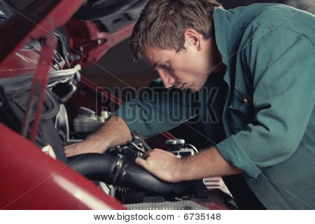 Mechanic Fixing Auto In Car Service