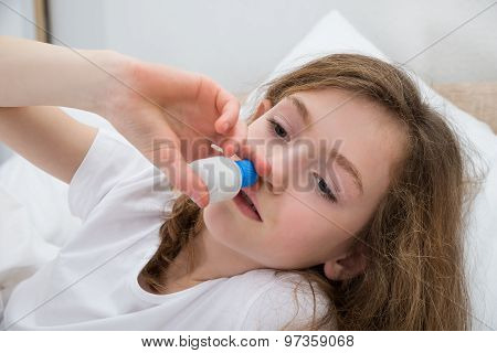 Girl Using Nasal Spray