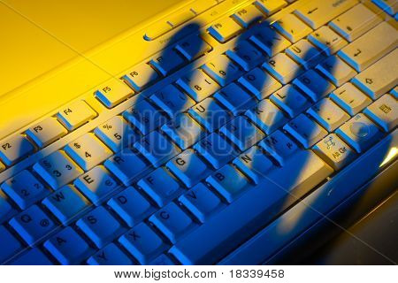 Keyboard and shadow. Data theft.