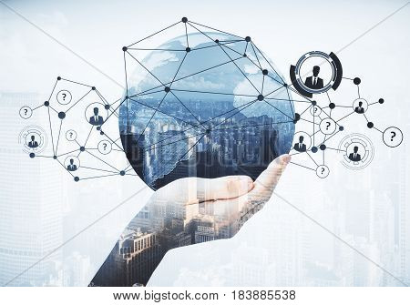 Close up of hand holding abstract globe with connections on city background. Communication concept. Double exposure