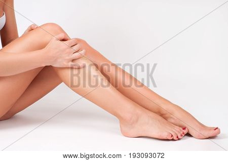 Hair Removal And Epilation. Woman Legs With Smooth Skin After Depilation.