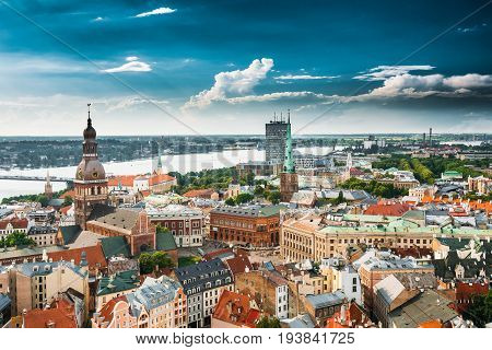 Riga, Latvia. Riga Cityscape In Sunny Summer Day. Famous Landmarks - Riga Dome Cathedral And St. James's Cathedral, or the Cathedral Basilica of St. James