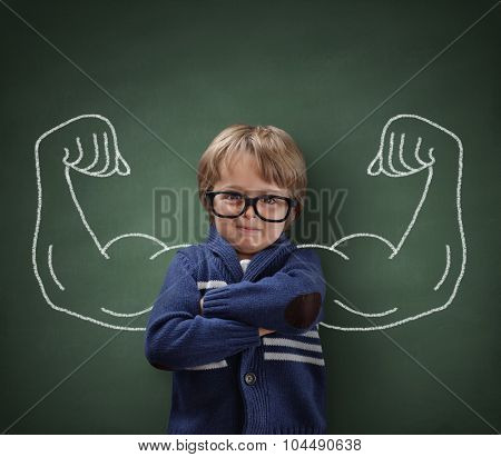 Strong man child showing bicep muscles concept for strength, confidence or defense from bullying