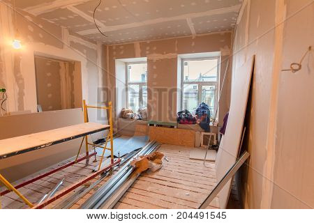 Material for repairs in an apartment is under construction remodeling rebuilding and renovation. Making walls from gypsum plasterboard or drywall.