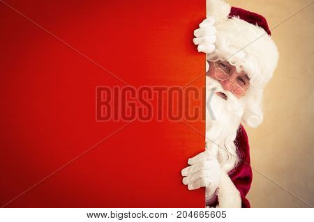 Santa Claus holding banner blank. Christmas holiday concept