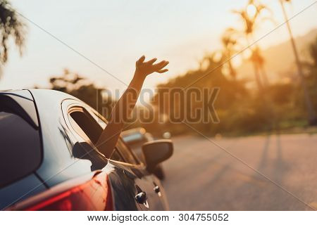 Hatchback Car Travel Driving Road Trip Of Woman Summer Vacation In Blue Car At Sunset,girls Happy Tr