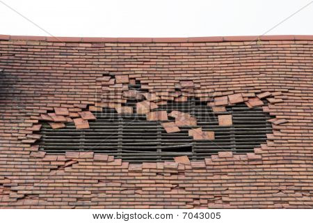 Damaged Roof With A Large Hole