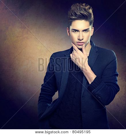 Fashion young model man portrait. Handsome Guy. Vogue style image of elegant young man. Studio fashion portrait. 