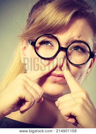 Girl Pinches Her Nose Because Of Stench Stink.